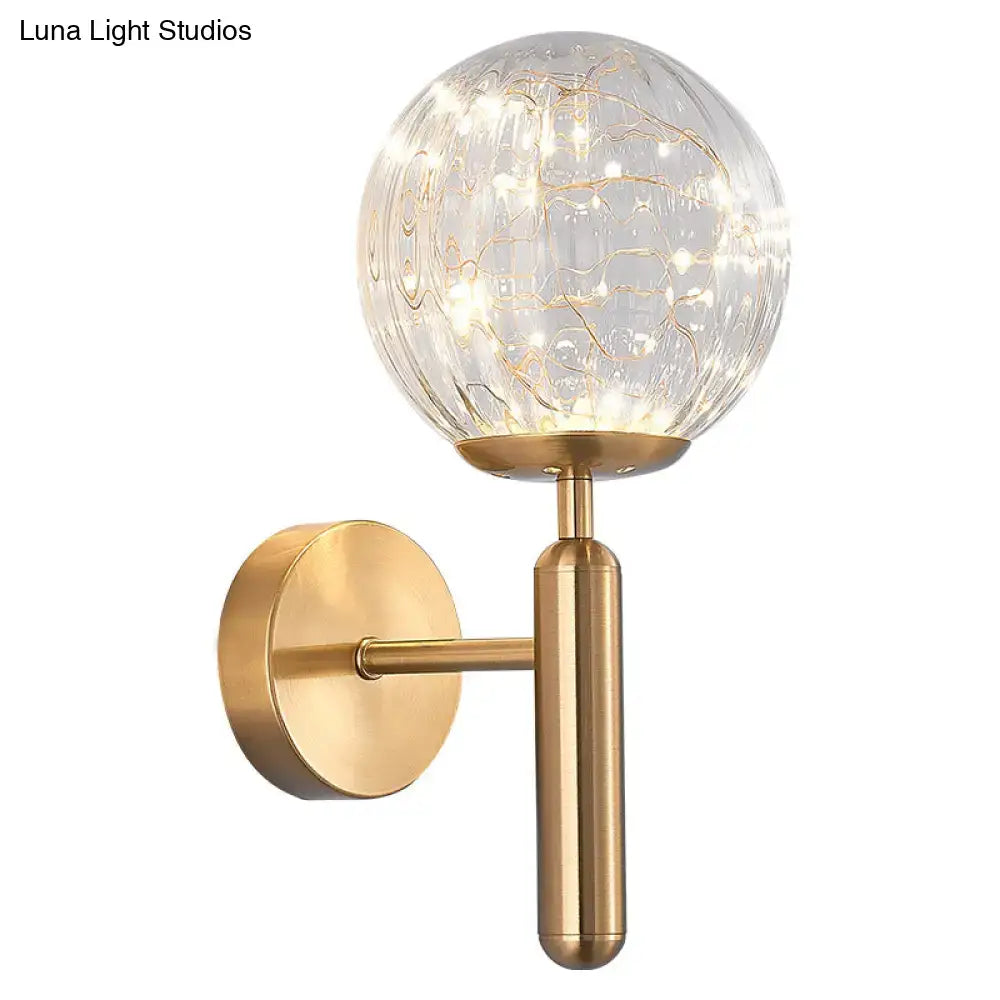 Postmodern black glass shade starry wall sconce with prismatic glass and brass base featuring warm led fairy lights