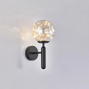 Postmodern black metal wall sconce with prismatic glass shade and warm fairy lights in modern style bedroom light