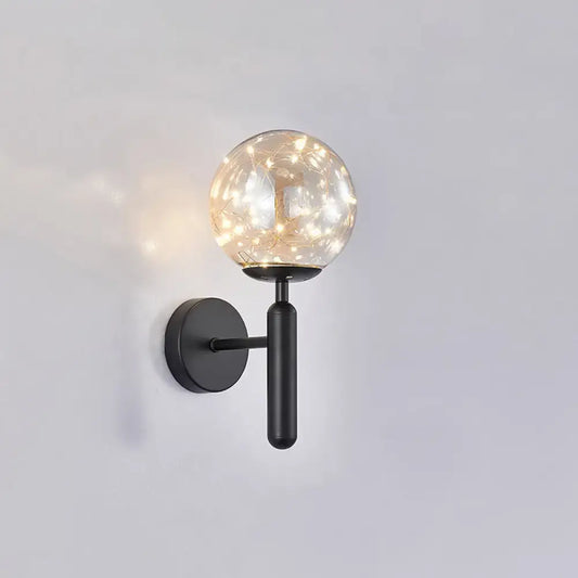 Postmodern black metal wall sconce with prismatic glass shade and warm fairy lights in modern style bedroom light