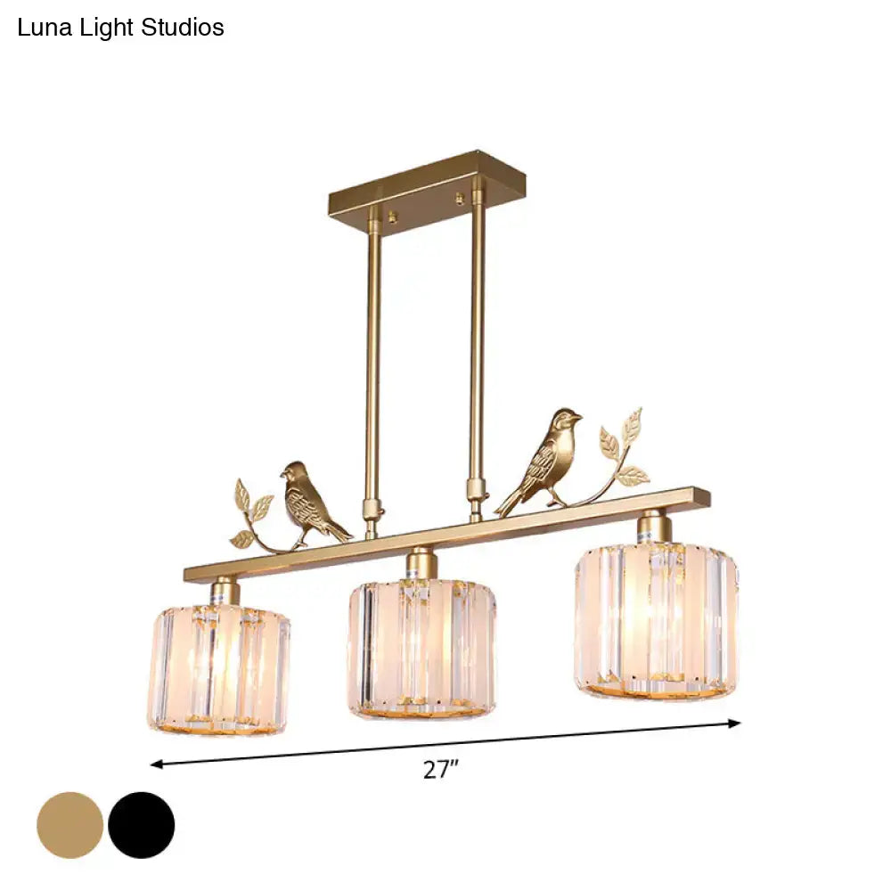 Gold-toned postmodern black gold crystal prism pendant hanging island light with three cylindrical shades and bird decoration