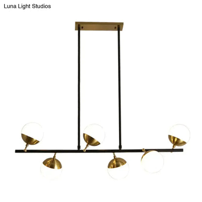 Modern black and gold island ceiling light with spherical glass shades for kitchen pendant lighting