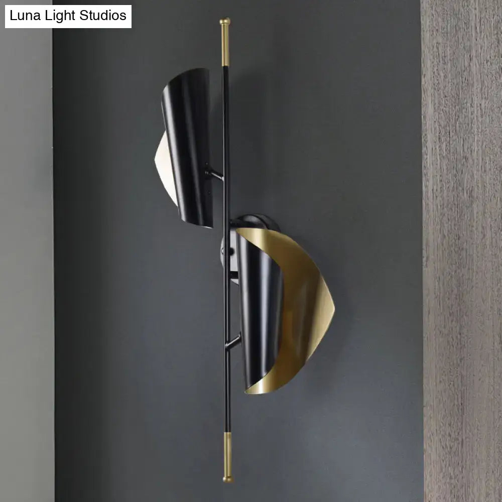 Modern black and gold metal sheet sconce wall light with sleek curved conical shades for stairway lighting