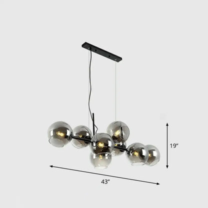 Postmodern black metal chandelier with eight clear smoke grey glass globe shades for dining room lighting type
