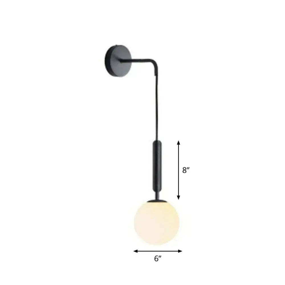 Postmodern black wall lamp with a spherical frosted glass globe and 8-inch curved arm for bedroom lighting