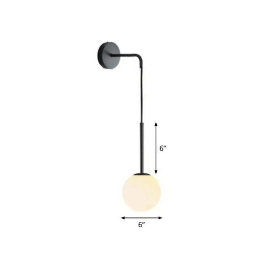 Postmodern black metal wall lamp with spherical frosted glass globe for bedroom lighting and decor