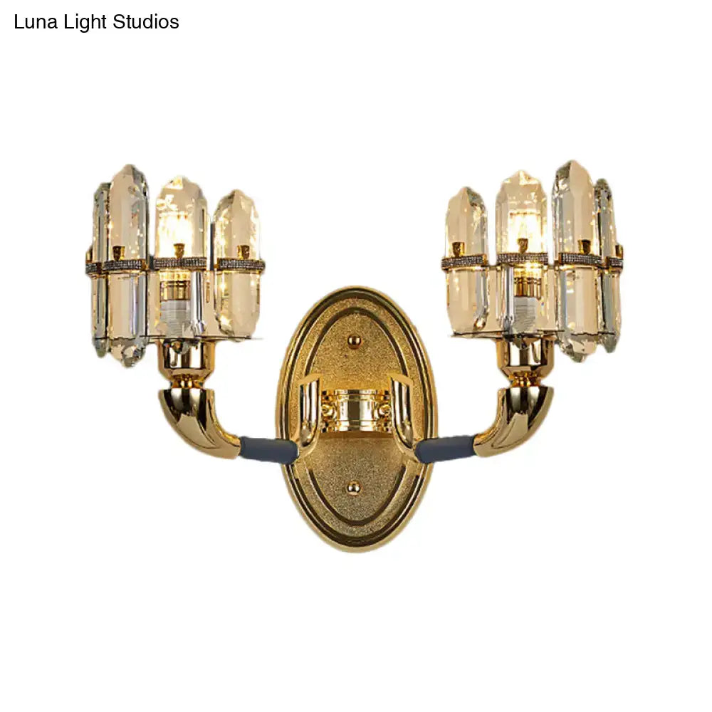 Gold-finished wall mount lamp with two arms and six faceted crystal shades for bedroom lighting