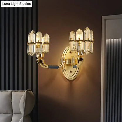 Postmodern blue and gold crystal wall mount lamp featuring a gold-toned multi-armed wall mount with clear glass shades