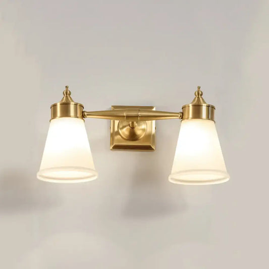 Postmodern brass wall sconce with two frosted cream glass shades for bathroom vanity lighting