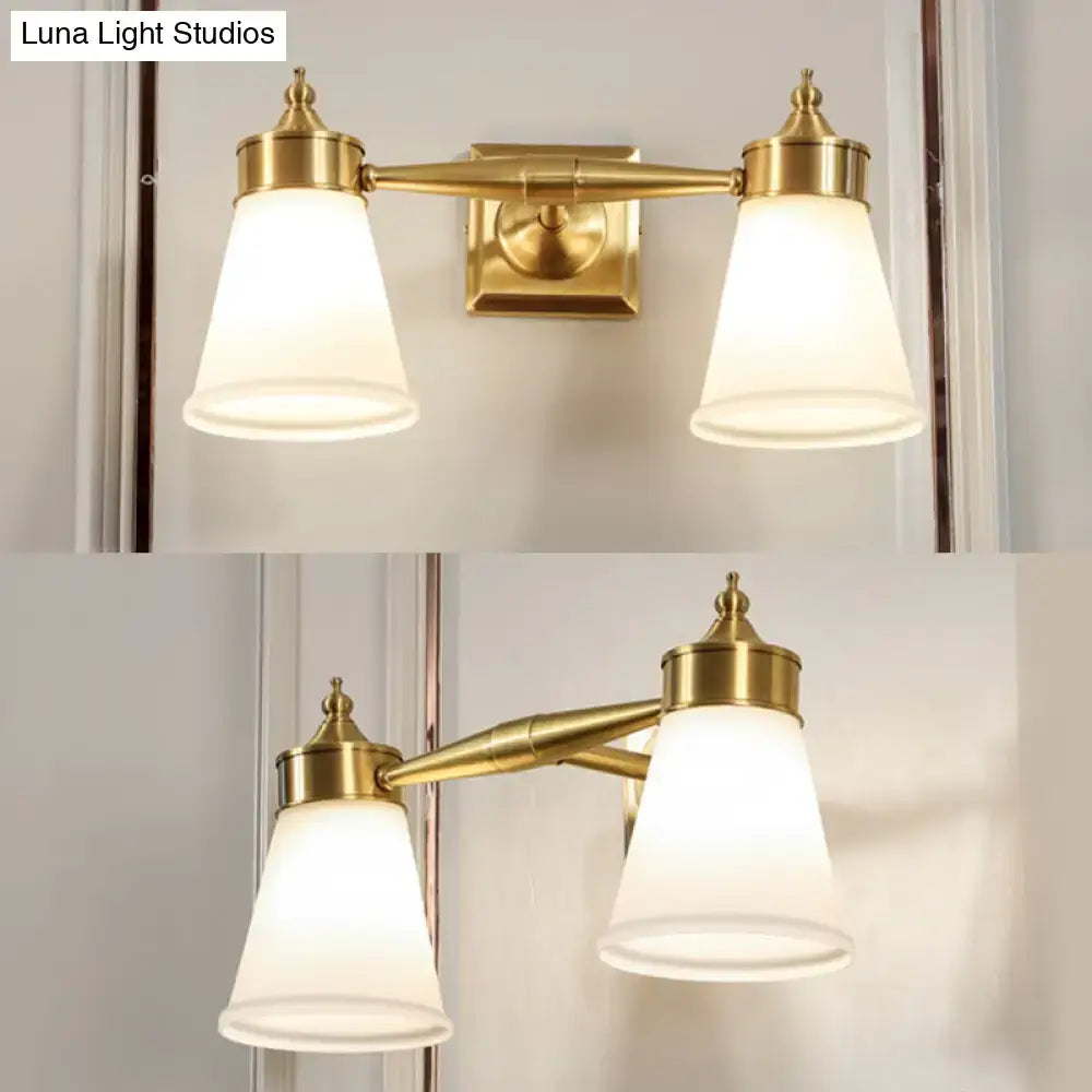 Postmodern brass and cream glass wall sconce with double frosted glass shades for bathroom vanity lighting