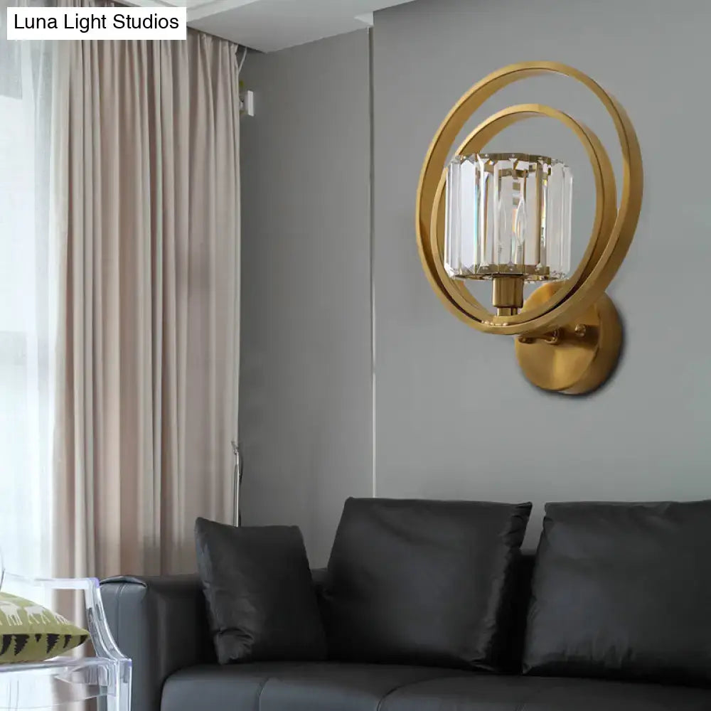Postmodern gold-toned brass and crystal drum wall mount light with two circular frames and crystal candle lamp