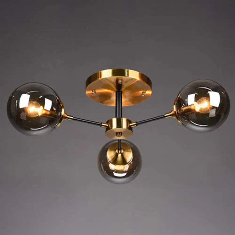 DecorBites™ DecorBites™ Postmodern Brass Finish Radial Ceiling Lamp with Glass Ball Shade