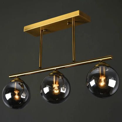 DecorBites™ Postmodern Brass Island Light with Globe Glass Shade: Stylish Metal Ceiling Fixture