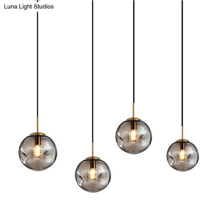 Postmodern Brass Pendant Lamp with Dimpled Glass Globe for Bedroom