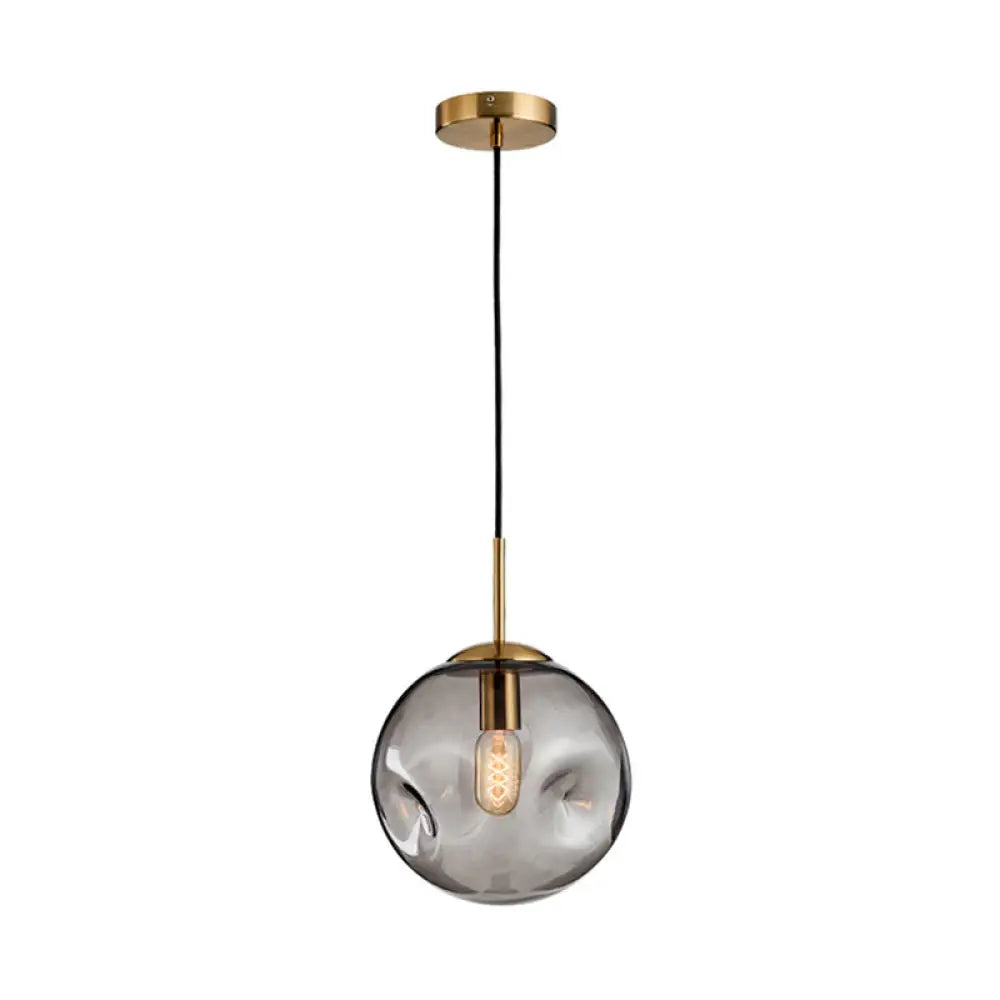 Postmodern Brass Pendant Lamp with Dimpled Glass Globe for Bedroom