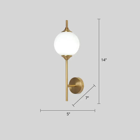 Postmodern gold-toned wall sconce with white glass geometric frosted globe for living room lighting