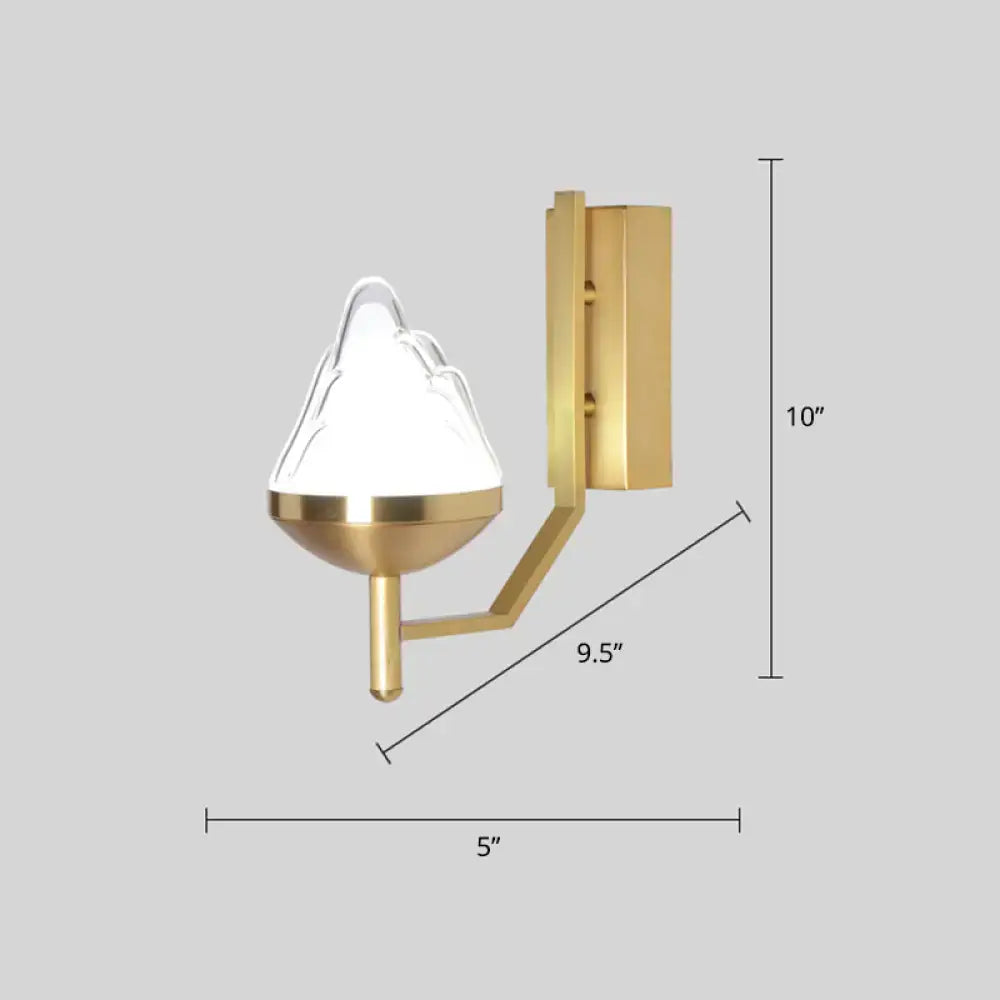 Postmodern brass wall sconce with a gold tone and white glass geometric mountain-shaped shade for living room use