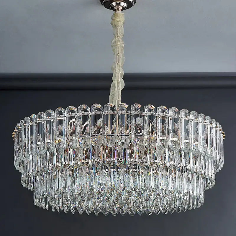 Postmodern decorbites crystal chandelier with clear faceted prisms and teardrop crystals in polished chrome fixture