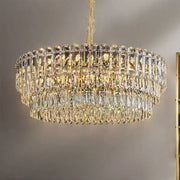 A postmodern decorbites crystal chandelier with cascading clear and gold glass prisms for dining room decor