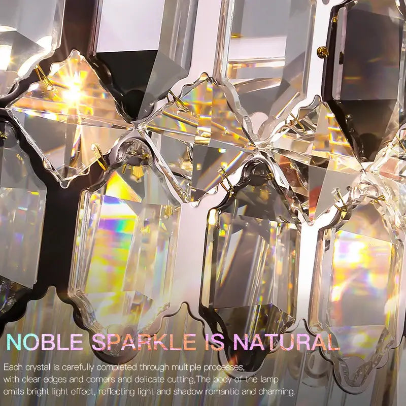A postmodern decorbites crystal chandelier with clear faceted prisms and gold metal accents for living room decor