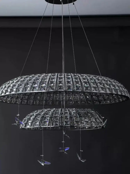Postmodern double-tiered pendant light with clear crystal segments and blue-tinted decorbites crystal butterfly accents