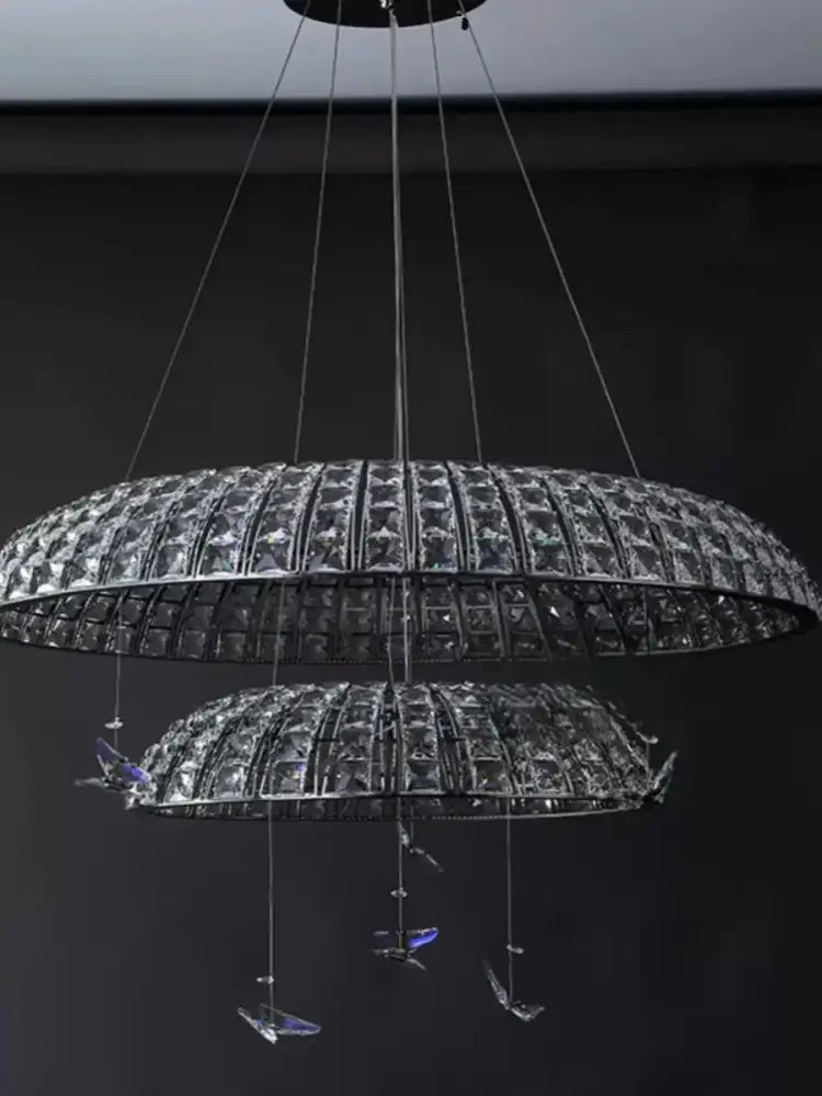 Postmodern double-tiered pendant light with clear crystal segments and blue-tinted decorbites crystal butterfly accents