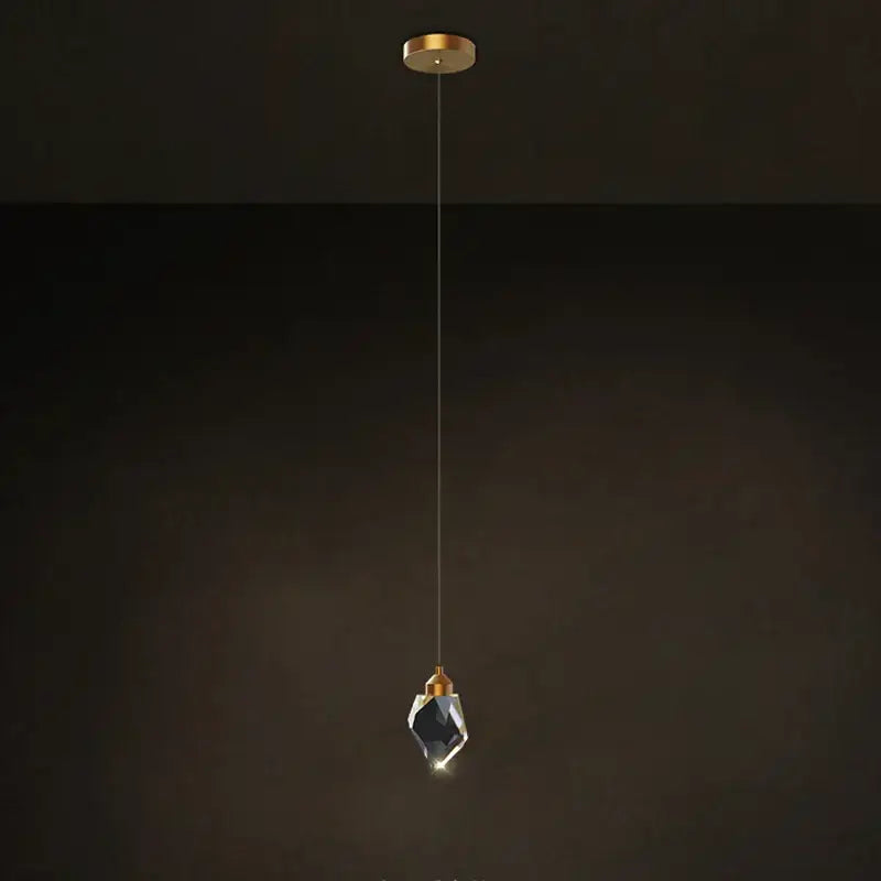 A postmodern stone copper chandelier with a faceted crystal stone copper shade and gold-toned hardware for staircase lighting