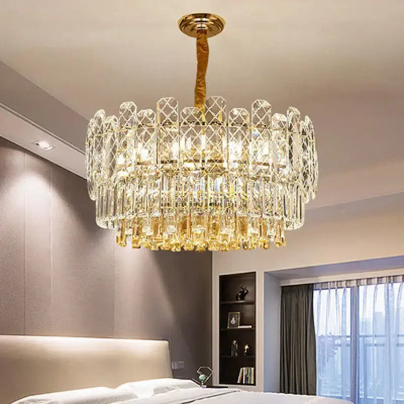 A luxurious decorbites gold lustre chandelier with gold tones and crystal prisms for dining room lighting