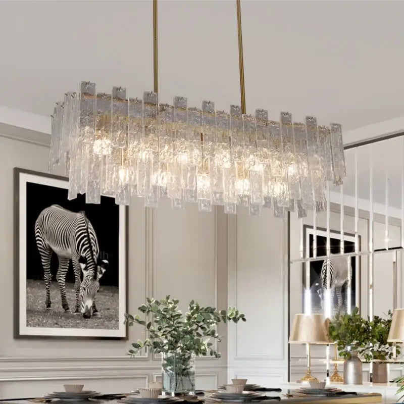 A modern rectangular postmodern frosted glass decorbites crystal chandelier with gold chains for dining room lighting
