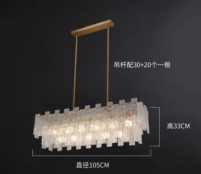 Gold-toned rectangular decorbites crystal chandelier with cascading textured glass rods for dining room light