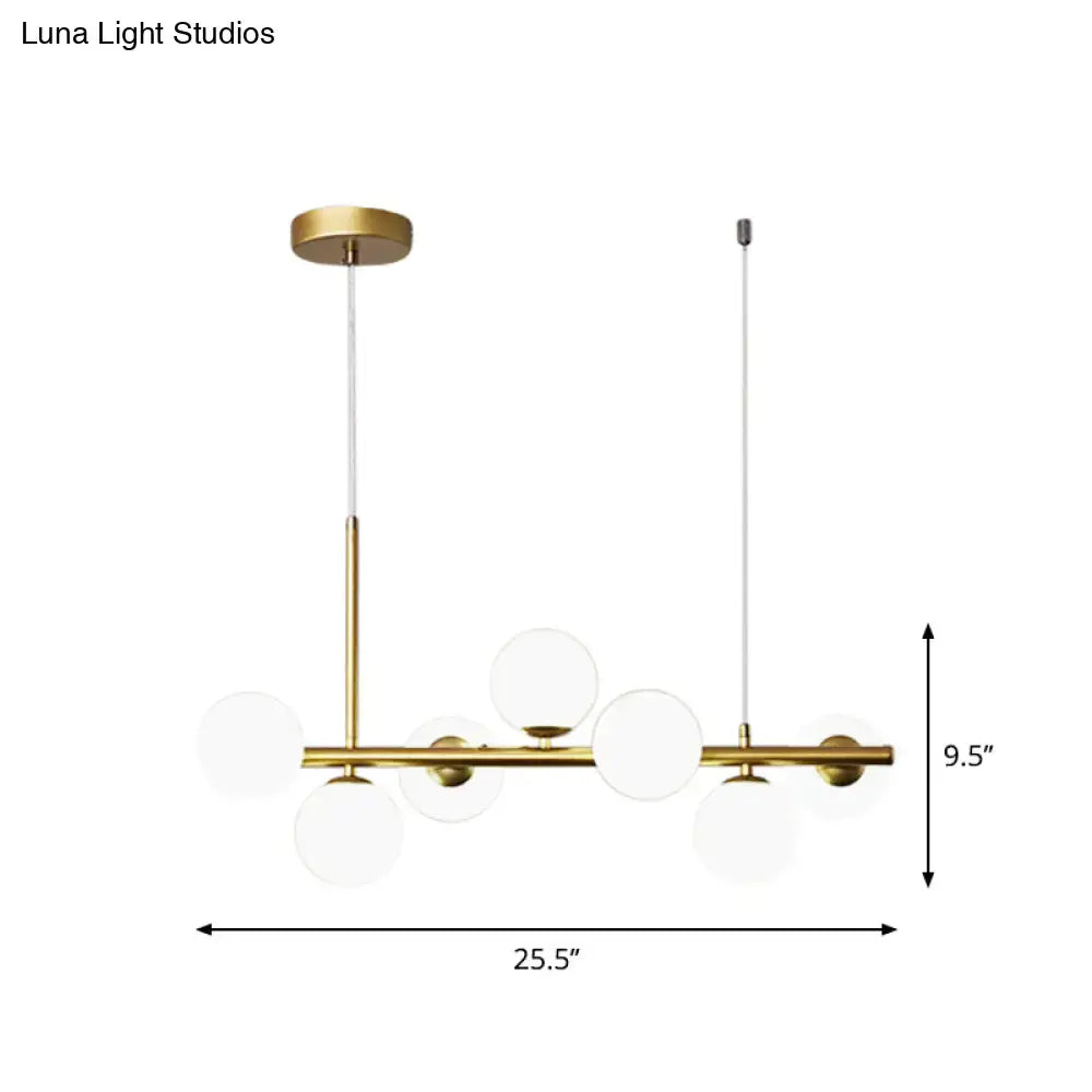Modern brass-finished pendant light with clear glass globe shades from decorbites postmodern kitchen collection