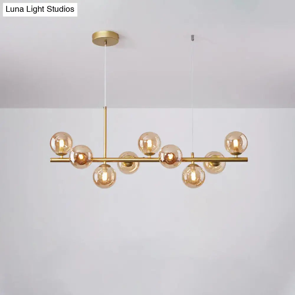 Gold-toned DecorBites postmodern pendant light with amber glass globe bulbs for kitchen in multiple finishes and sizes