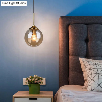 Postmodern Glass Pendant Light: Sphere Drop Design with Bedside & Ceiling Mounts - Brass Finish