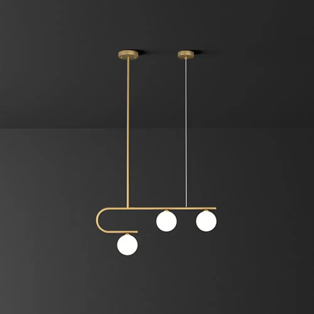 DecorBites™ postmodern gold linear island pendant light with ivory ball glass and three spherical bulbs suspended by rods