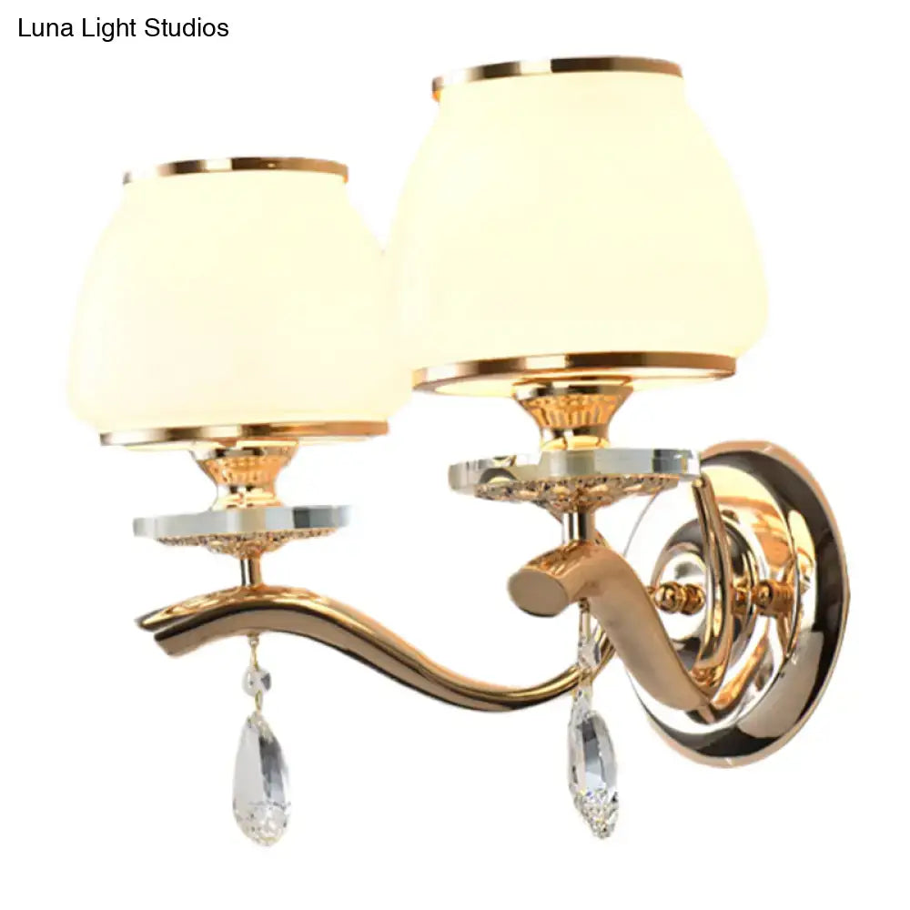 Postmodern gold wall sconce with white glass shades and crystal drop pendants direct wired for bedroom lighting
