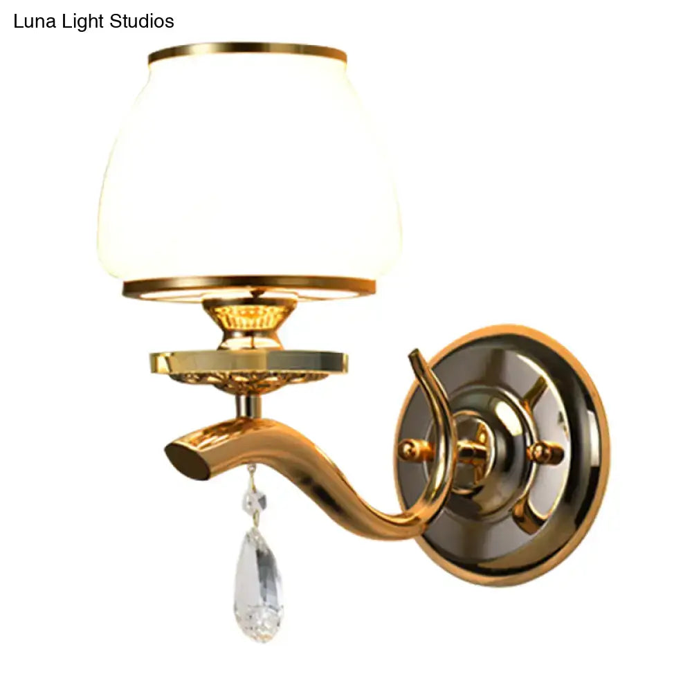 Postmodern gold wall sconce with white glass shade and crystal drop direct wired for bedroom lighting