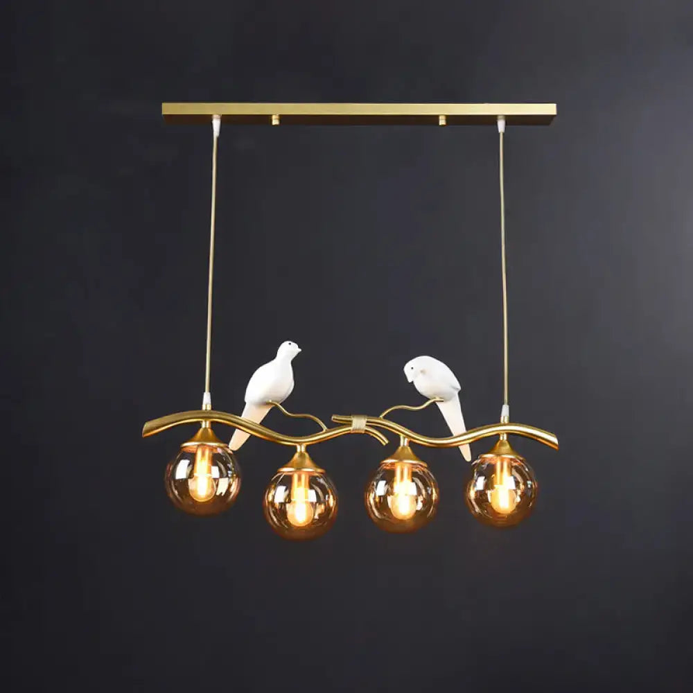 DecorBites sleek postmodern gold-toned pendant light with white ceramic bird deco and amber glass globes for 110v-120v use