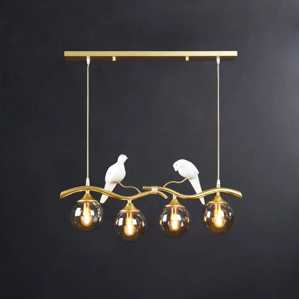 Gold-toned DecorBites sleek postmodern glass pendant light with white ceramic bird deco and amber filament globes, 110v-120v 220v-240v compatible