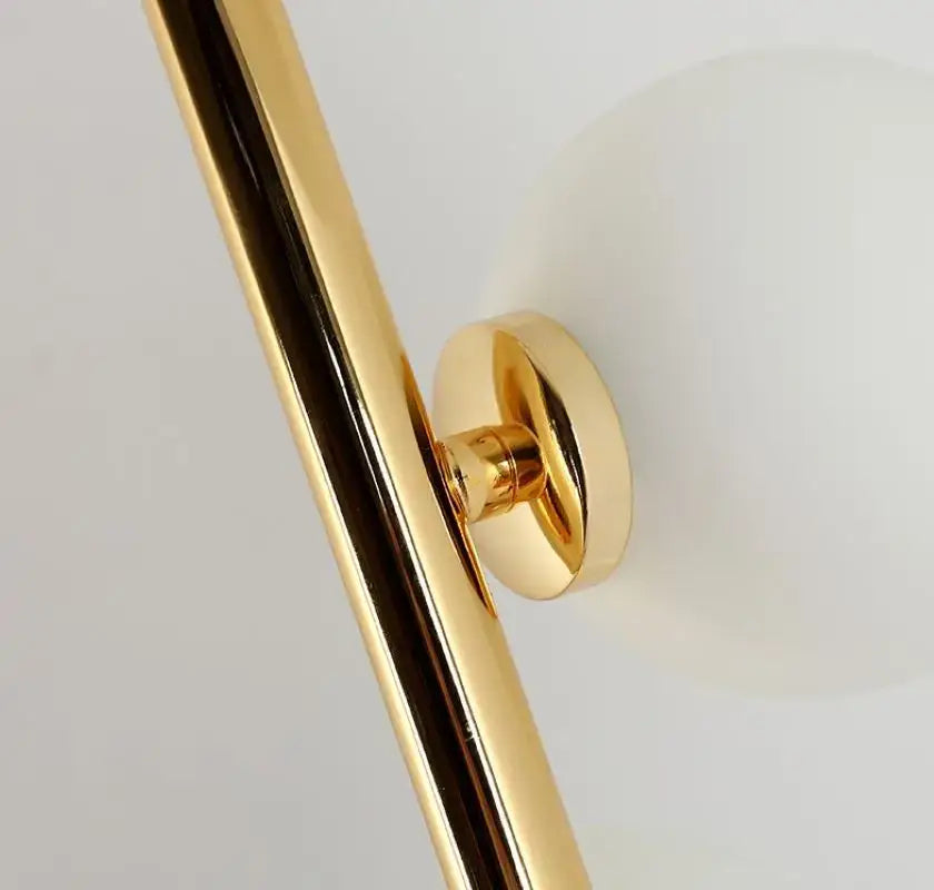 Gold finished metal rod with circular mounting bracket for postmodern gold and black glass floor lamp cascade light