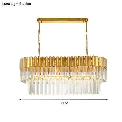 Postmodern gold rectangular light fixture with clear crystal prisms and polished brass frame for dining room island