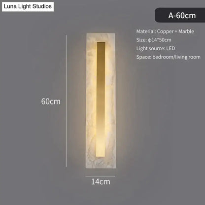 A sleek postmodern copper marble wall lamp with warm lighting for living room featuring rectangular design