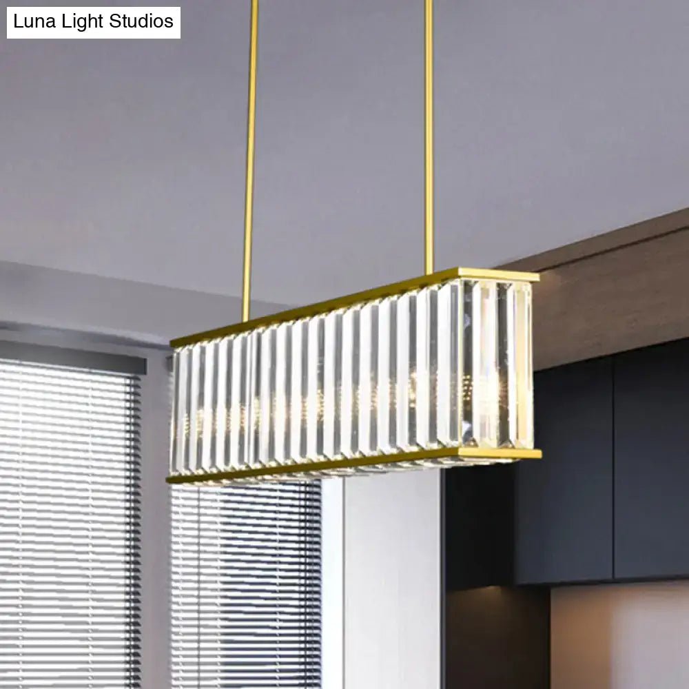 Decorbites gold crystal rod island light with gold frame and rectangular shade shape featuring vertical crystal rods