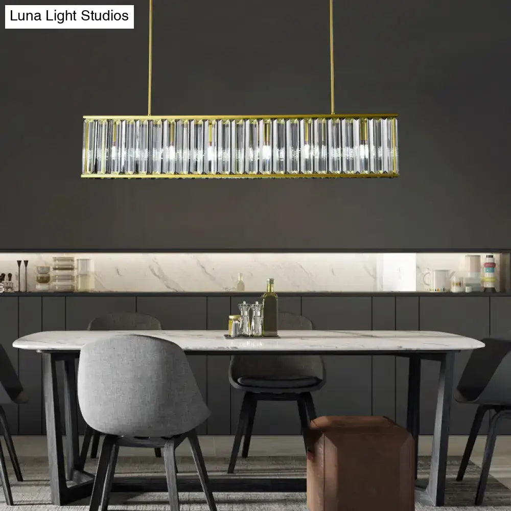 Gold-framed decorbites™ island light with clear crystal rod shade shape and four rectangular heads pendant fixture