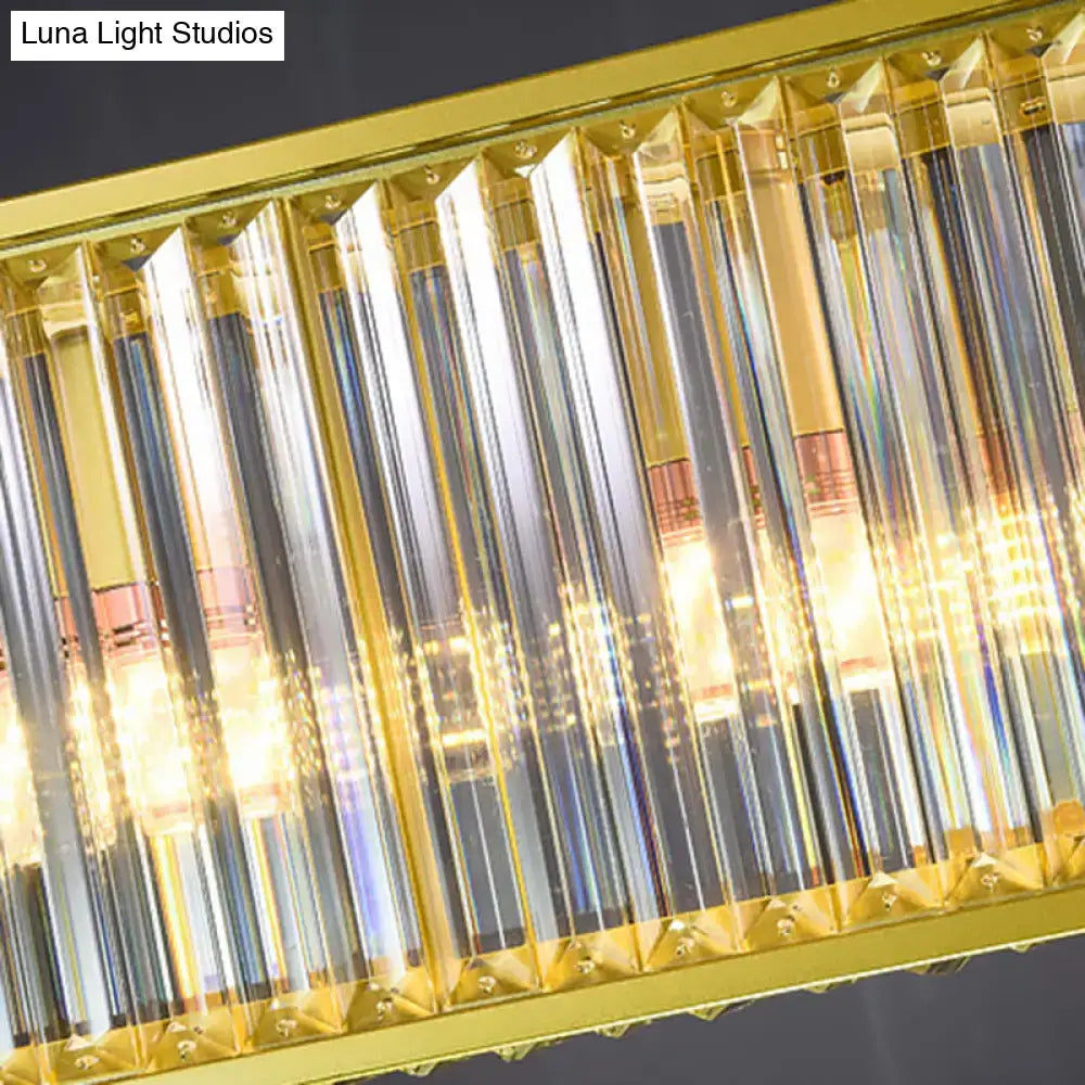 DecorBites gold crystal rod island light with rectangular shade shape and clear faceted prisms refracting warm light