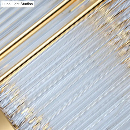 A modern postmodern gold crystal rod island light with slender translucent glass rods for dining room use