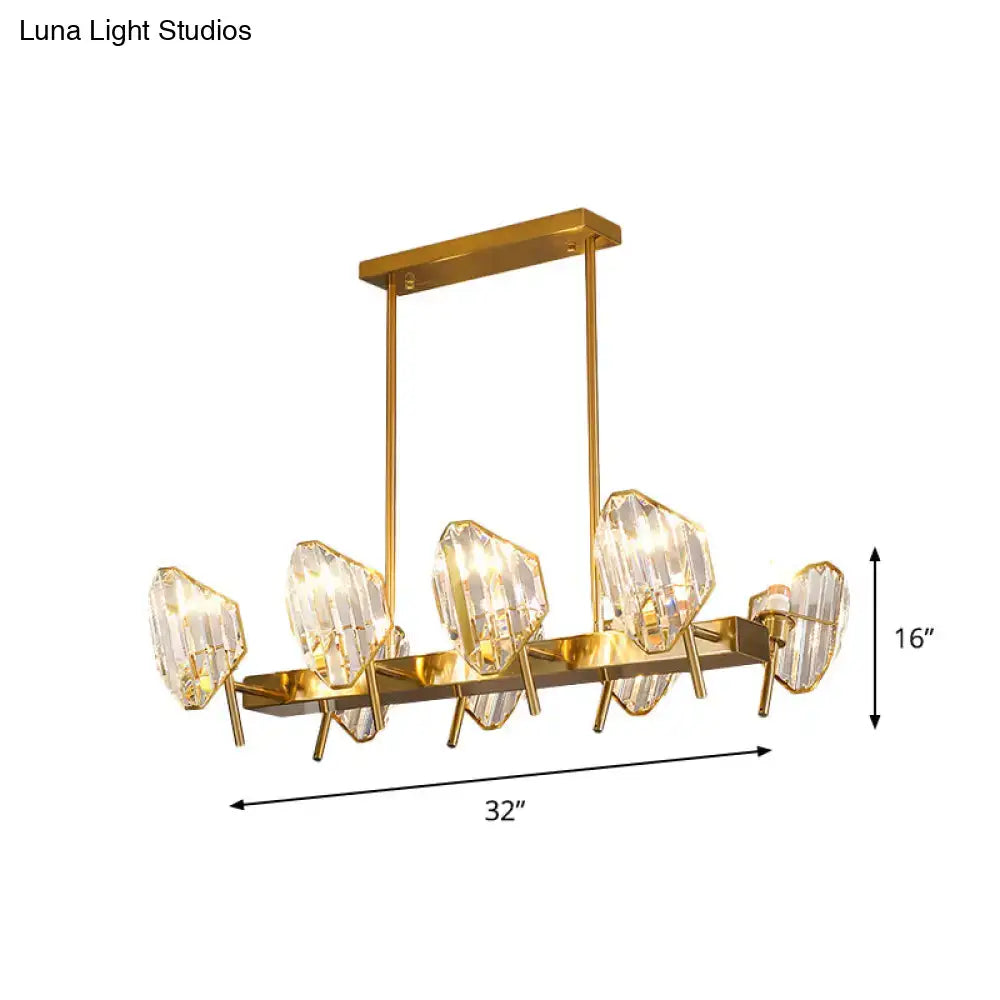 Gold-toned crystal shield pendant light with five faceted crystal shield pendants on a rectangular frame for kitchen island lighting