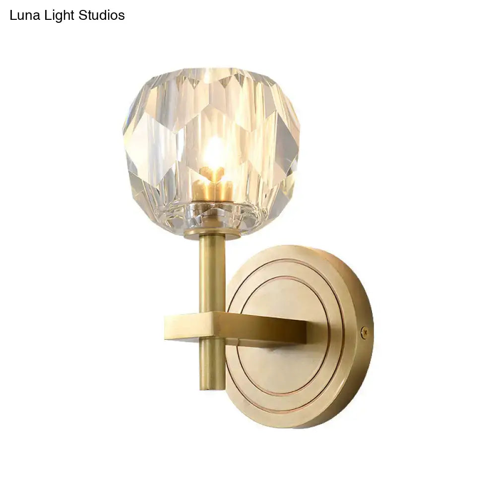 Postmodern brass-finished wall mounted light with faceted crystal globe shade for living room sconce lighting