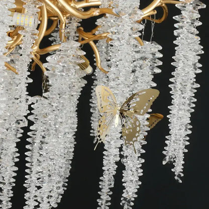 Golden butterfly ornament hanging from a decorbites crystal chandelier for dining room postmodern gold decorbites crystal chandelier