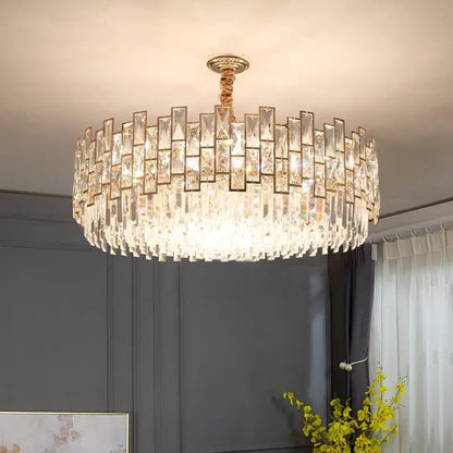 Postmodern gold decorbites crystal chandelier with clear faceted prisms in concentric rings for living room decor