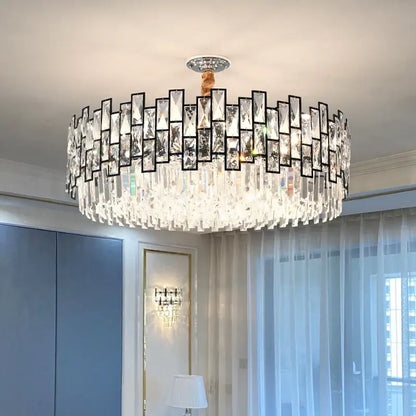 A modern black metal decorbites crystal chandelier with rectangular prisms and cascading glass droplets for living rooms