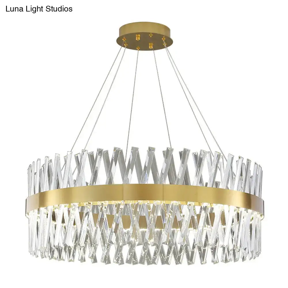 Modern circular pendant light with gold finish metal frame and interlocking k9 crystal prisms for bedroom use